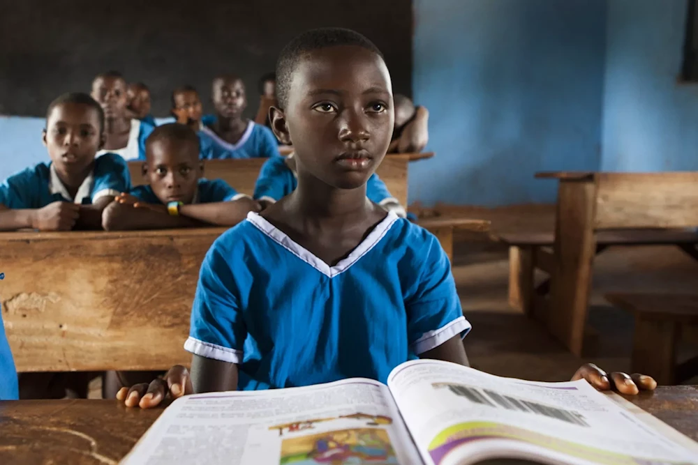 Illustrative: A child studying at a school in Nigeria (UNICEF)