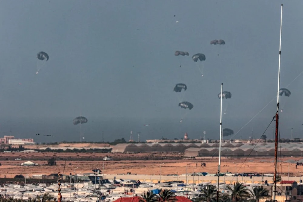 A Jordanian military aircraft drops insufficient humanitarian aid over Rafah and Khan Younis. (AFP)