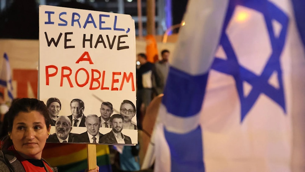 An Israeli protester attends a rally against Prime Minister Benjamin Netanyahu's new hard-right government in “Tel Aviv” on Jan. 21. (AFP via Getty Images)