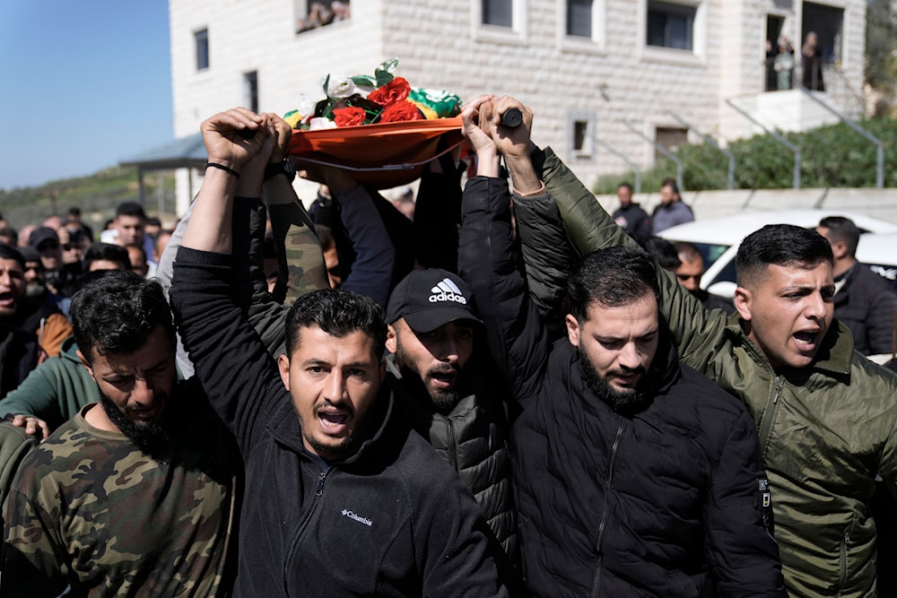 Palestinians carry the body of martyr Amr al-Najjar, 11, during his funeral in the West Bank village of Burin, near Nablus, Tuesday, March 5, 2024(AP).