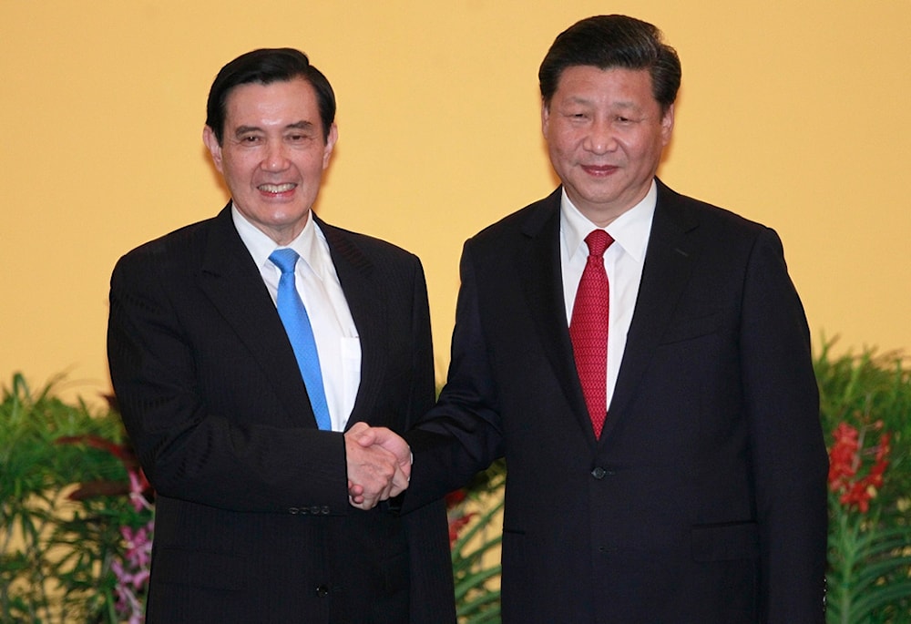 Then Taiwan's President Ma Ying-jeou, left, and China's President Xi Jinping shake hands at the Shangri-la Hotel on Nov. 7, 2015 (AP)