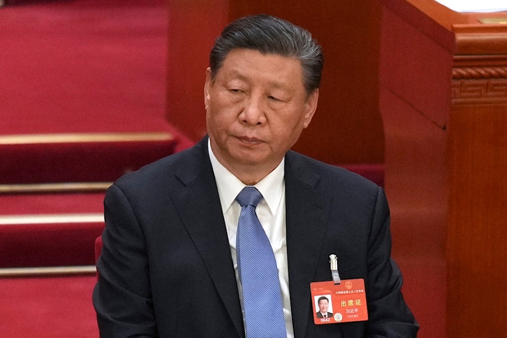 Chinese President Xi Jinping attends during the second plenary session meeting of the National People's Congress (NPC) in the Great Hall of the People in Beijing, China, Friday, March 8, 2024. (AP)