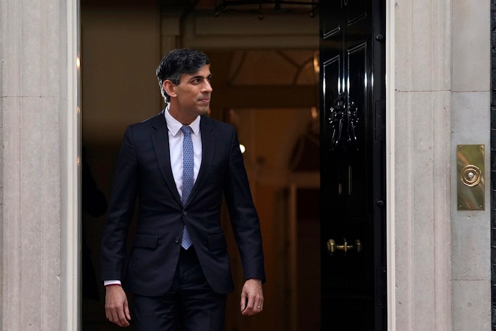 Britain's Prime Minister Rishi Sunak waits to greet the President of Rwanda Paul Kagame on the doorstep of 10 Downing Street in London, Tuesday, April 9, 2024. (AP)