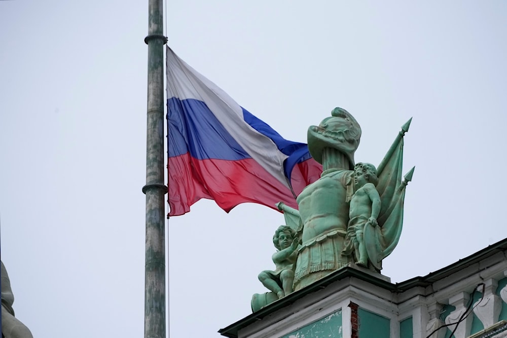 A Russian national flag is at half-mast over the Hermitage Museum in St. Petersburg, Russia, Sunday, March 24, 2024. (AP)