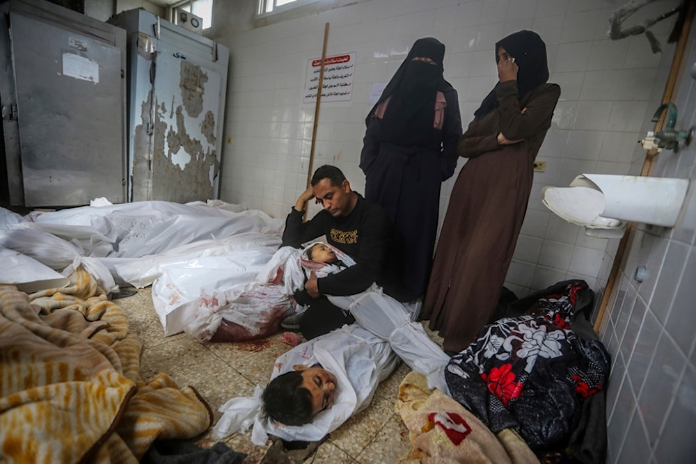 Palestinians mourn over the bodies of relatives killed in the Israeli occupation's bombardment of the Gaza Strip at the morgue of Al Aqsa Hospital in Deir al Balah, Palestine, April 10, 2024. (AP)