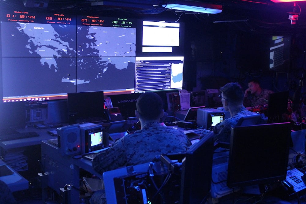 U.S. Marines on watch stander duty monitor screens at the Land Force Operation Center Unit on the USS Bataan in the Aegean Sea, Greece, Friday, Jan. 19, 2024. (AP)