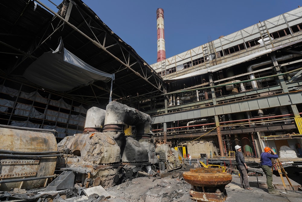 Workers repair damaged thermal power plant, one of the country's largest, recently destroyed by Russian missiles in Ukraine Friday, April 12, 2024. (AP)