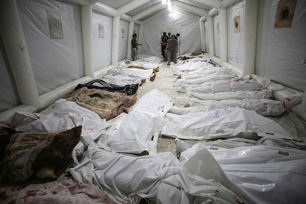 Bodies of Palestinians killed by an explosion at the Ahli Arab hospital are gathered at the front yard of the al-Shifa hospital, in Gaza City, central Gaza Strip, Tuesday, Oct. 17, 2023. (AP)