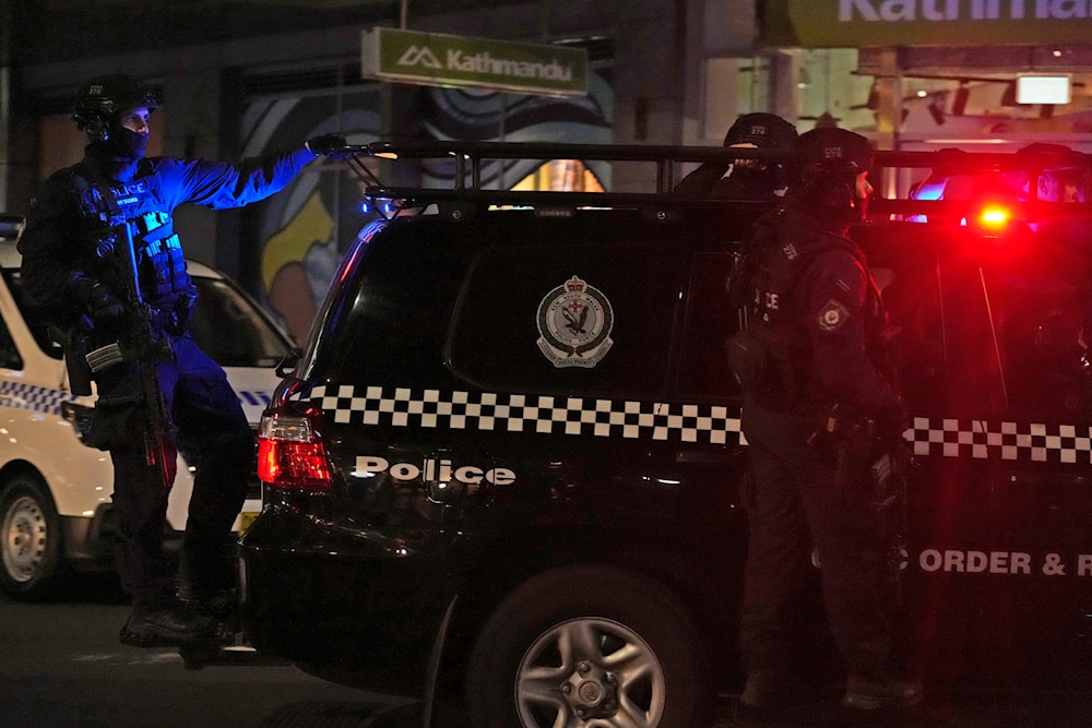 Tactical police leave Westfield Shopping Centre, where multiple people were stabbed in Sydney, Saturday, April 13, 2024. (AP)