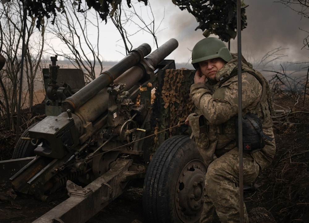 Ukrainian soldiers of the 71st Jaeger Brigade fire a M101 howitzer towards Russian positions at the frontline, near Avdiivka, Donetsk region, Ukraine, Friday, March 22, 2024. (AP)