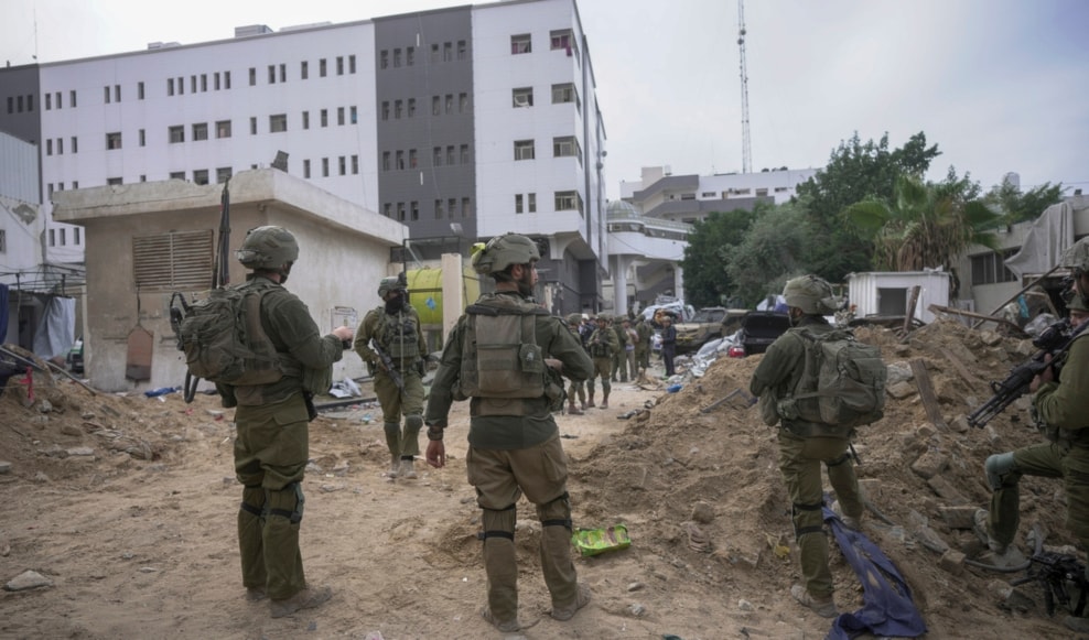 Israeli occupation forces stand outside al-Shifa Hospital in Gaza City, Wednesday, Nov. 22, 2023. (AP)