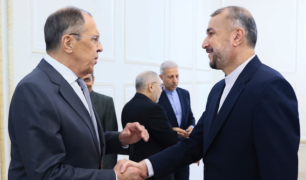  Russian Foreign Minister Sergey Lavrov, left, and Iranian Foreign Minister Hossein Amir-Abdollahian greet each other during their meeting in Tehran, Monday, Oct. 23, 2023 (AP)