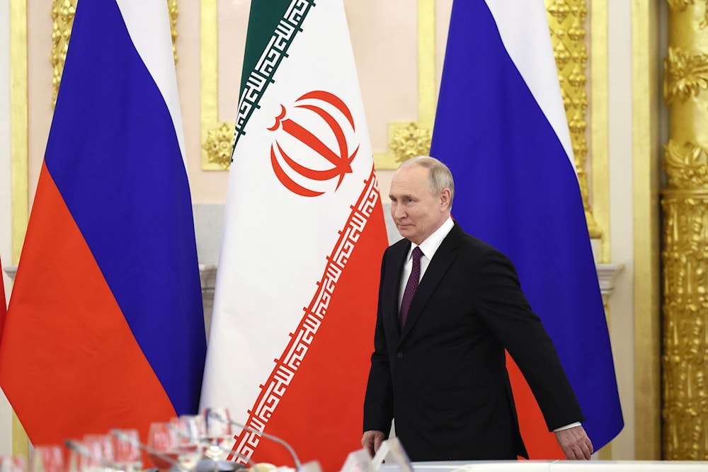 Russian President Vladimir Putin arrives to attend talks with Iranian President Ebrahim Raisi at the Kremlin in Moscow, Russia, Thursday, Dec. 7, 2023. (Sputnik, Kremlin Pool Photo via AP)