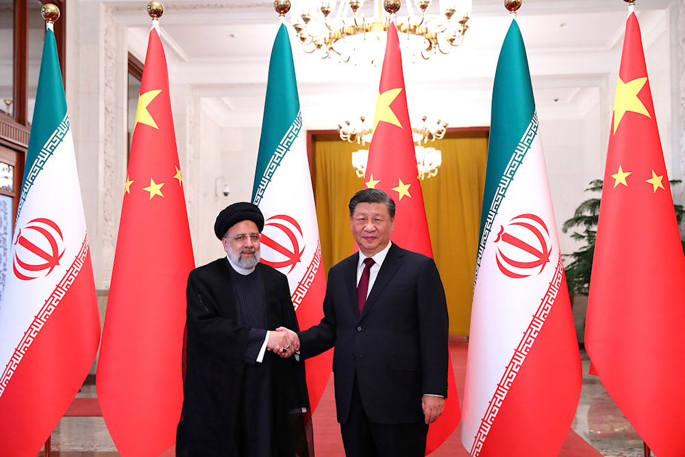 Iranian President Ebrahim Raisi with his Chinese counterpart Xi Jinping in an official welcoming ceremony in Beijing, Feb. 14, 2023. (Iranian Presidency Office via AP)