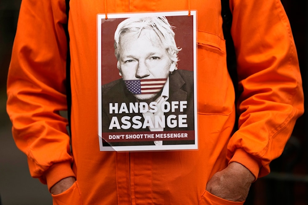 A Protester stands in front of the Ecuadorian Embassy in London, Thursday, April 11, 2024, where Wikileaks founder Julian Assange was arrested five years ago (AP)