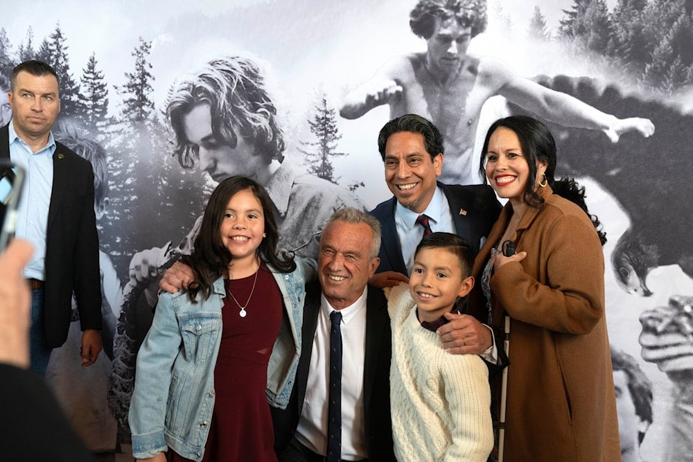 Independent presidential candidate Robert F. Kennedy, Jr. poses for a photo with a family of supporters prior to a campaign event, Saturday, March 30, 2024, in Los Angeles. (AP)