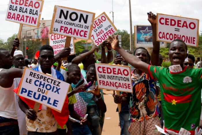 Protest against France and the West African regional bloc known as ECOWAS in the streets of Ouagadougou, Burkina Faso, on October 4, 2022. (AP)