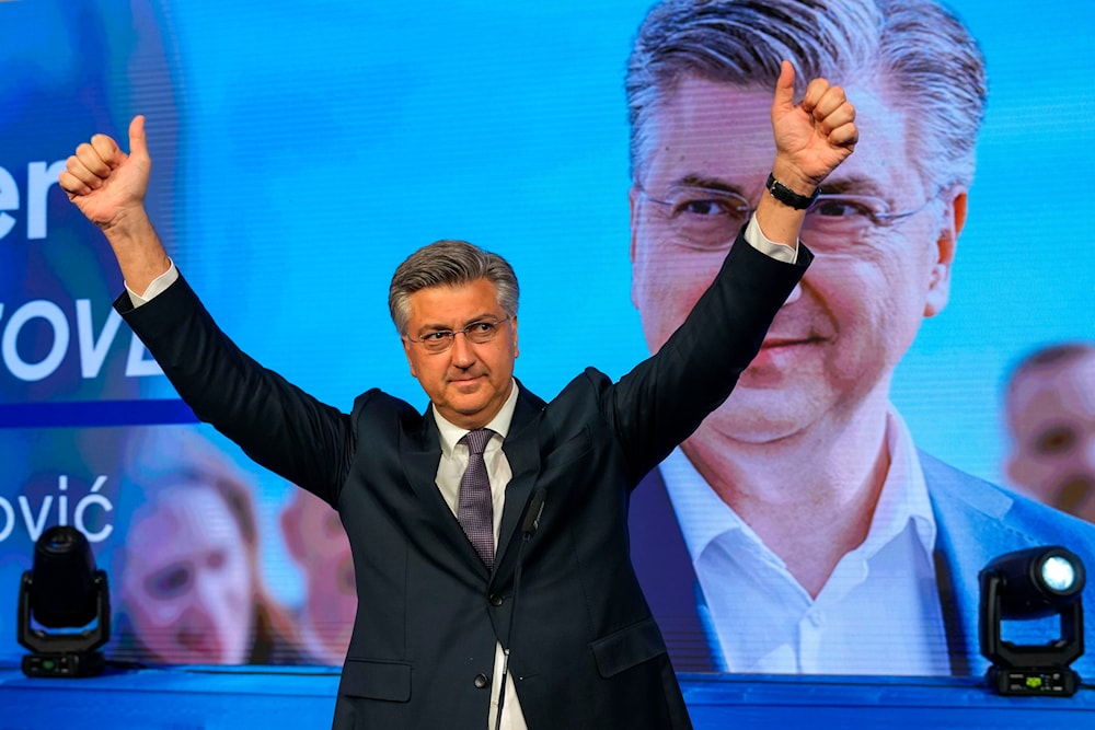 Prime Minister incumbent Andrej Plenkovic waves after claiming victory in a parliamentary election in Zagreb, Croatia, Thursday, April 18, 2024. (AP)