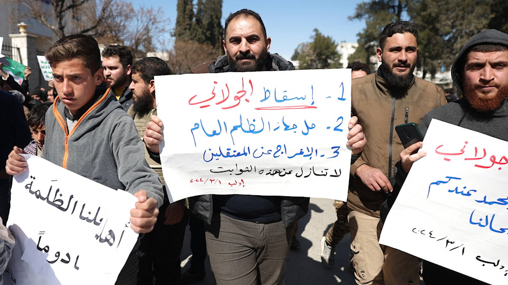Protesters rally in the town of Idlib in Syria's northwestern Idlib province against Hayat Tahrir al-Sham on 1 March 2024.(AFP)