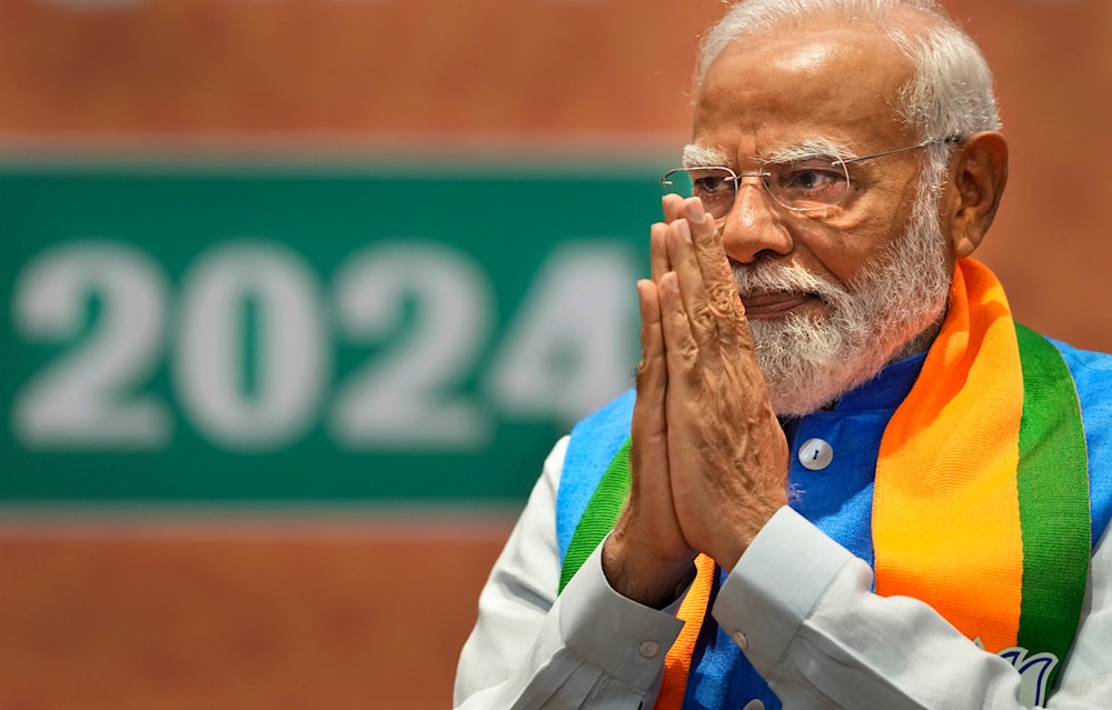 Indian Prime Minister Narendra Modi greets during the unveiling of his Hindu nationalist Bharatiya Janata party’s election manifesto in New Delhi, India, April 14, 2024. (AP)