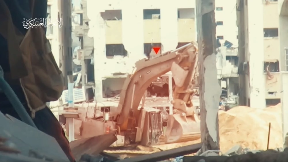 Previous scenes of Al-Qassam Brigades mujahideen targeting an occupation bulldozer in Gaza City (military media)