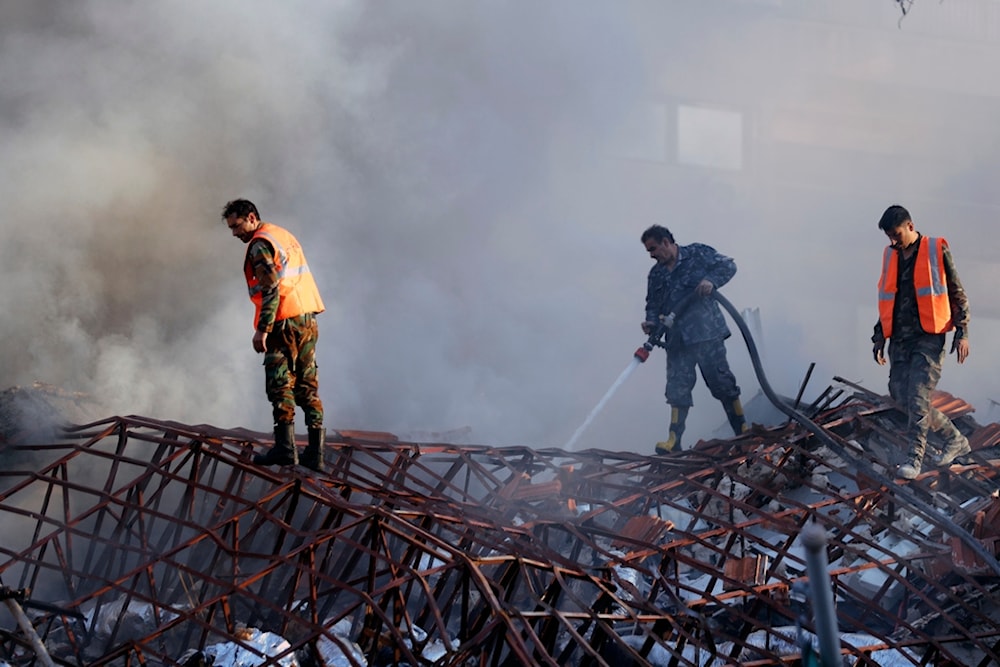 Emergency services work at a destroyed Iranian consulate building hit by an air strike in Damascus, Syria, Monday, April 1, 2024 (AP Photo/Omar Sanadiki)
