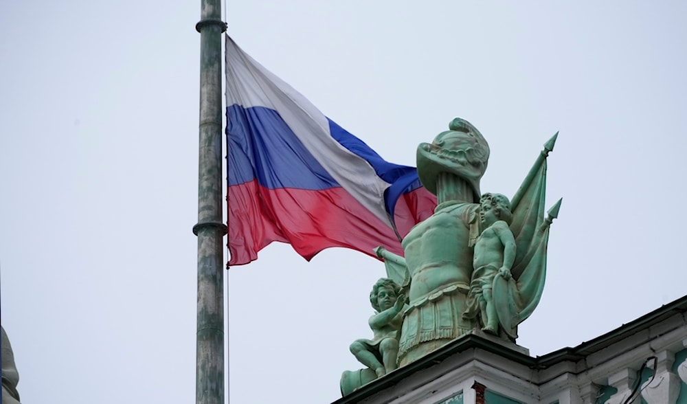 A Russian national flag is at half-mast over the Hermitage Museum in St. Petersburg, Russia, Sunday, March 24, 2024 (AP)
