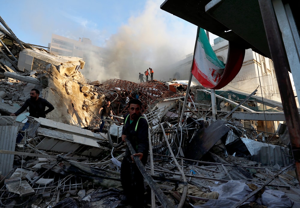 Emergency services work at the Iranian consulate in Syria hit by an Israeli airstrike in Damascus, Syria, Monday, April 1, 2024. (AP)