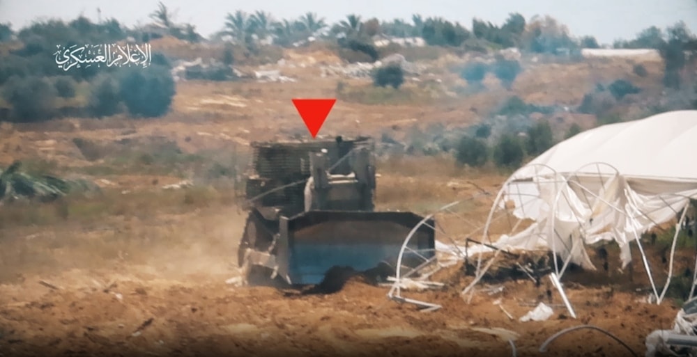 From scenes of Al-Qassam targeting an Israeli D9 military bulldozer with an Al-Yassin 105 shell, east of Deir Al-Balah, in the central Gaza Strip. (Al-Qassam Brigades military media)