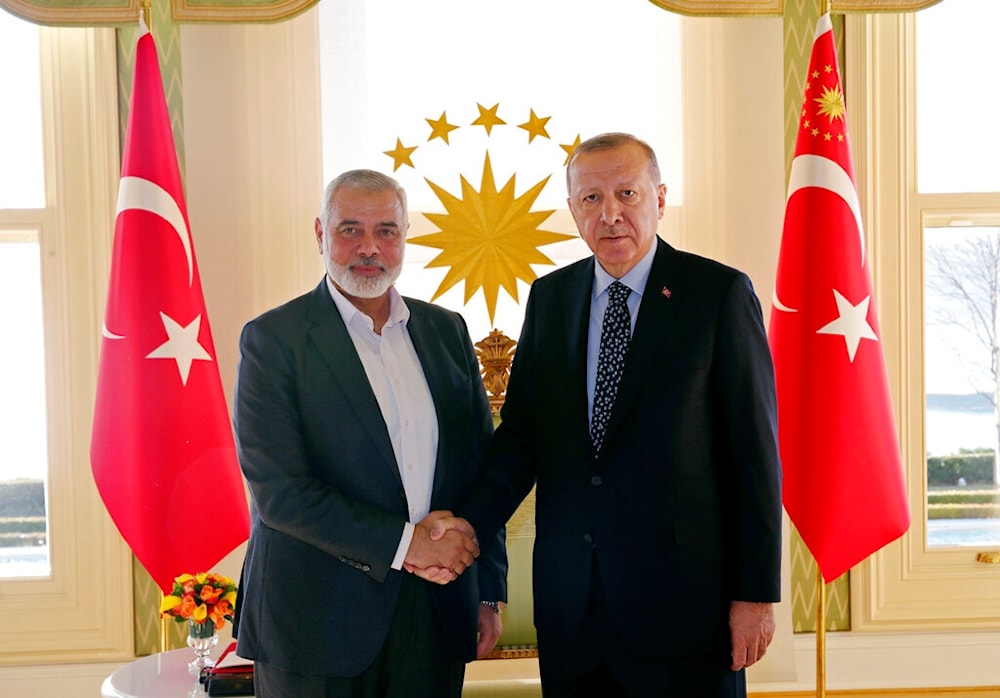 In this Feb. 1, 2020 file photo, Turkey's President Recep Tayyip Erdogan, right, shakes hands with Hamas movement chief Ismail Haniyeh, prior to their meeting in Istanbul (AP)