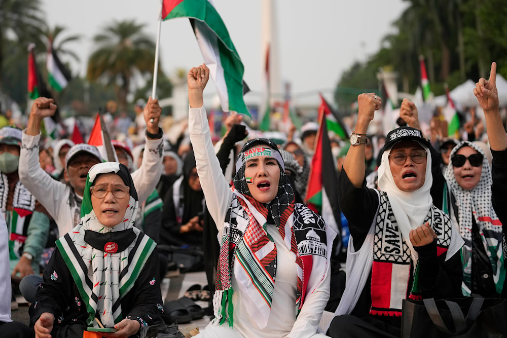 Protesters shout slogans during a rally and prayer in support of the Palestinians in Gaza, in Jakarta, Indonesia, Sunday, April 7, 2024. (AP)