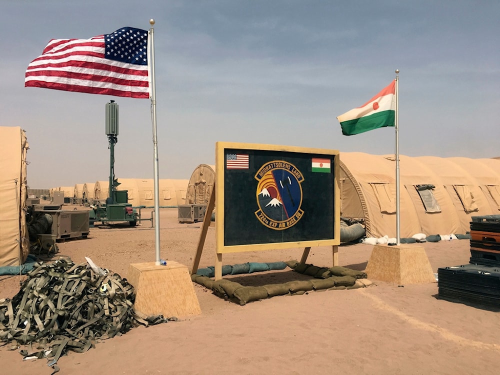A US and Niger flag are raised side by side at the base camp for air forces and other personnel supporting the construction of Niger Air Base 201 in Agadez, Niger, April 16, 2018. (AP)