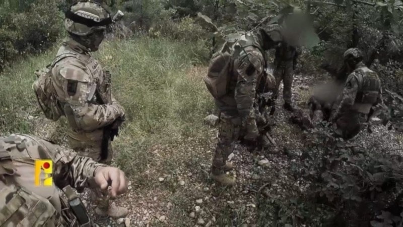 A screenshot from a video released by the Islamic Resistance in Lebanon, Hezbollah showing footage of its fighters preparing for an operation against positions for the IOF on November 10, 2023. (Military Media) 