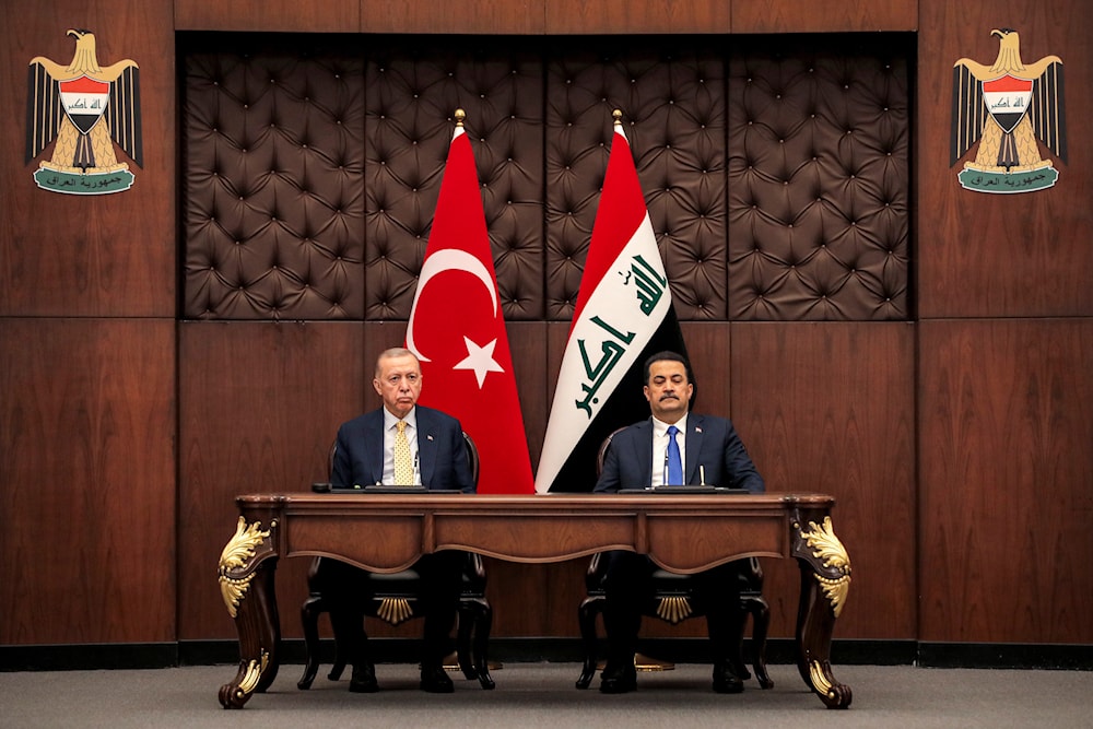 Iraq's Prime Minister Mohammed Shia al-Sudani, right, and Turkey's President Recep Tayyip Erdogan sit together during their meeting in Baghdad, Iraq, Monday April 22, 2024. (Pool via AP)