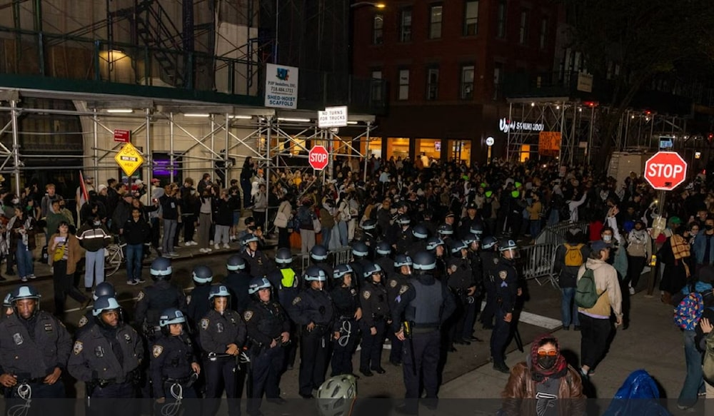 NYPD officers stand by after detaining demonstrators and clearing an encampment set up by pro-Palestinian students and protesters on the campus of New York University (AFP via Getty Images)