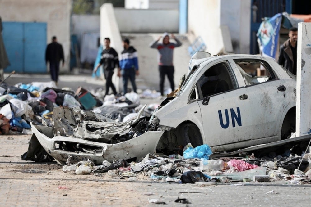 Palestinians walk through the destruction left by the Israeli air and ground offensive on the Gaza strip in Gaza City, Saturday, February 10, 2024. (AP)