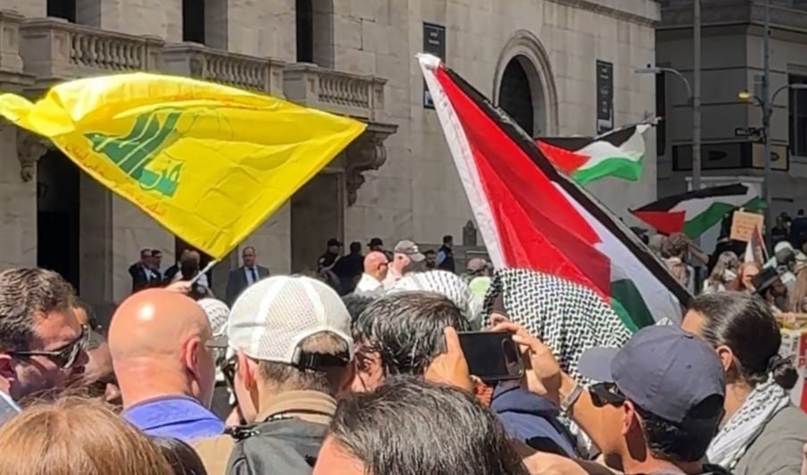 Image emerging on social media showing Hezbollah's flag alongside Palestine's flag flying in on Wall Street, New York, US, on April 25, 2024. (Social media)