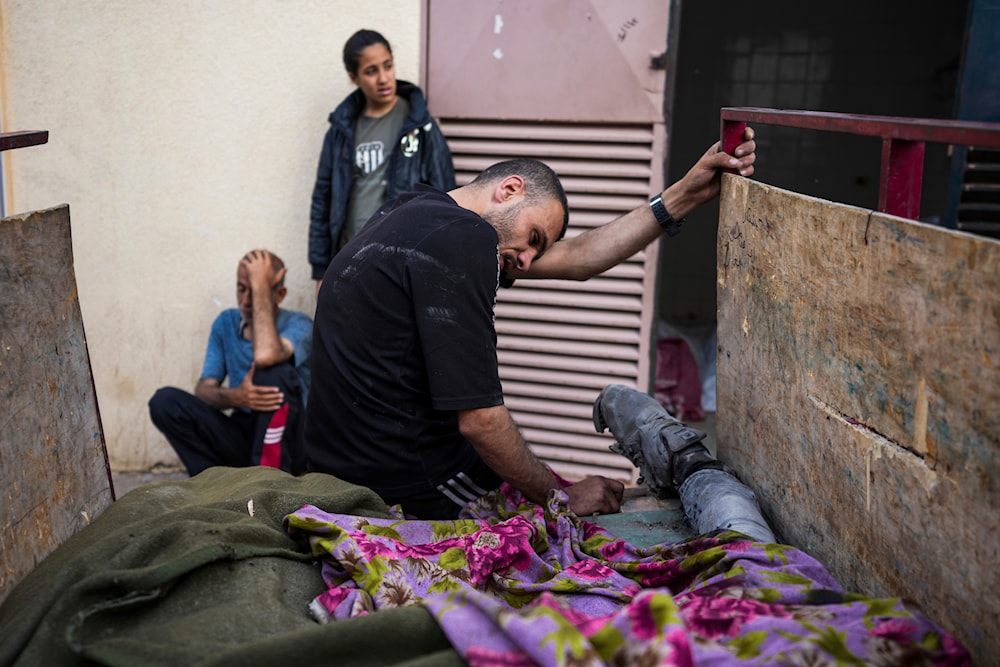 Palestinians mourn their relatives killed in the Israeli bombardment of the Gaza Strip at the Al Aqsa hospital in Deir al Balah, Thursday, April 25, 2024. (AP)