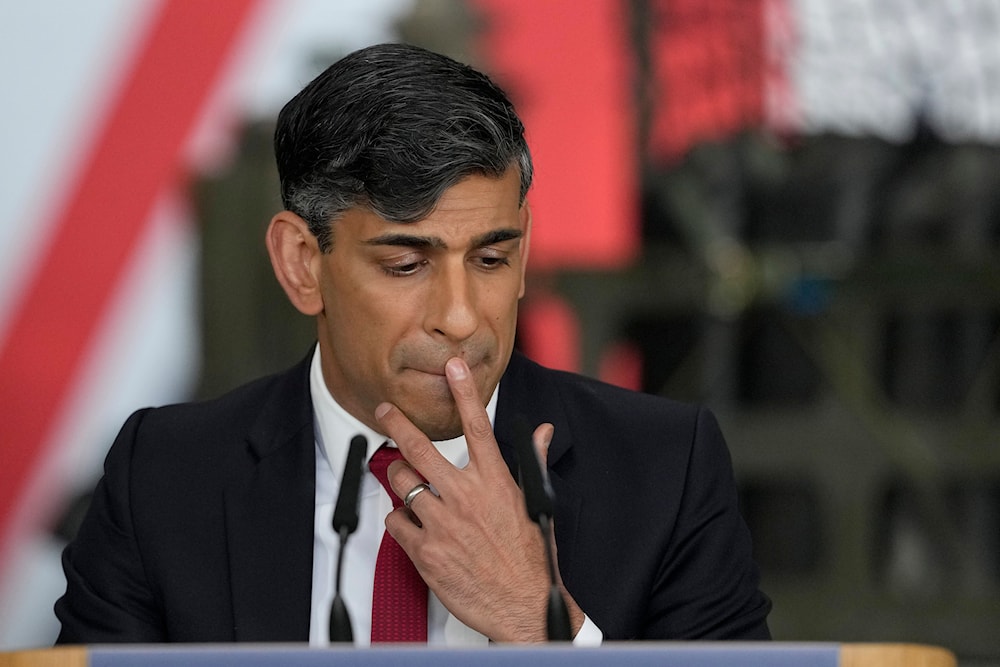 Britain's Prime Minister Rishi Sunak pauses as he addresses a press conference at the Warsaw Armoured Brigade in Warsaw, Poland, Tuesday, April 23, 2024. (AP)