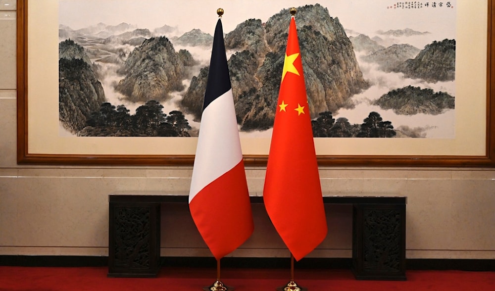 The flags of France, and China are seen during a meeting between France's Minister for Foreign and European Affairs Stephane Sejourne and China's Foreign Minister Wang Yi at the Diaoyutai State Guest House in Beijing Monday, April 1, 2024. (AP)