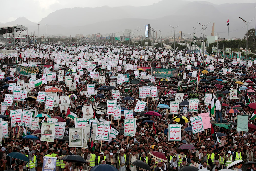 Thousands of Yemenis attend a rally against the US and 