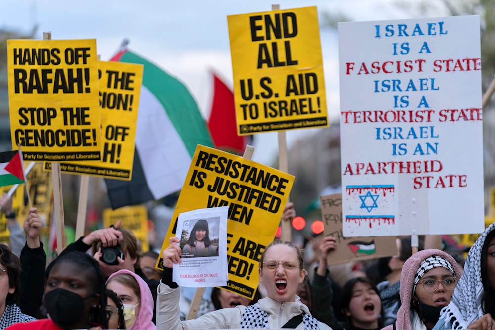 Demonstrators march to the White House in support of Palestinians, Saturday, March 30, 2024, in Washington. (AP)