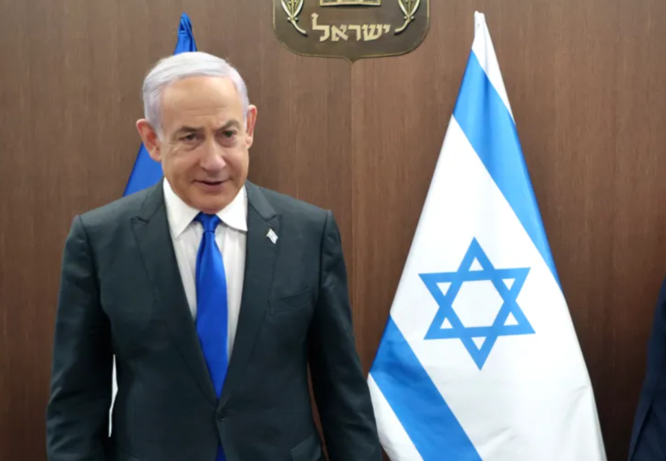 Israeli Prime Minister Benjamin Netanyahu, left, takes a seat before his meeting with French Foreign Minister Stephane Sejourne, right, in Jerusalem on Feb. 5, 2024.