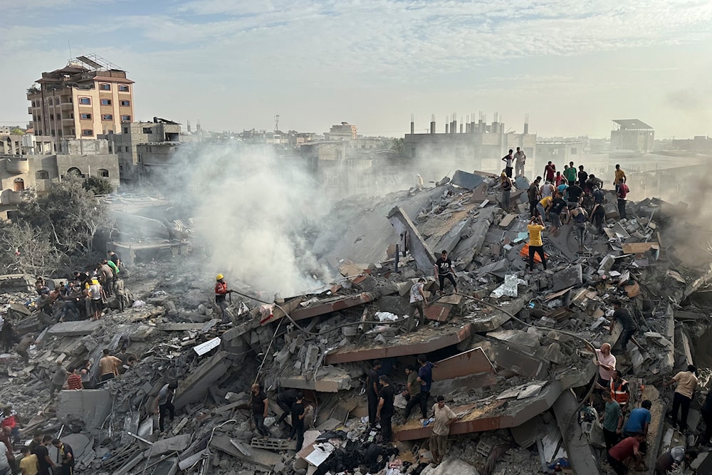 Palestinians look for survivors following Israeli airstrike in Nuseirat refugee camp, Gaza Strip, Tuesday, Oct. 31, 2023. (AP)