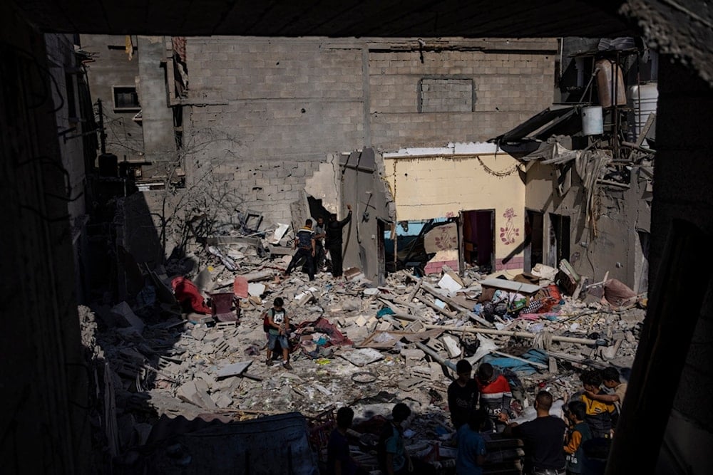 Members of the Abu Draz family inspect their house after it was hit by an Israeli airstrike in Rafah, southern Gaza Strip, Thursday, April 4, 2024. (AP)