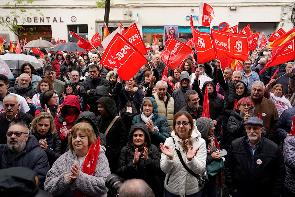 Supporters of Spain's Prime Minister Pedro Sánchez gather at the PSOE party headquarter during a demonstration in Madrid, Spain, Saturday, April 27, 2024 (AP)