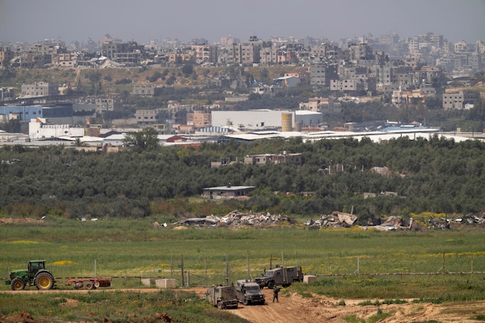 Israeli troops are seen near the separation line with Gaza Strip, in southern Palestine, Wednesday, March 27, 2024. (AP Photo/Ohad Zwigenberg)