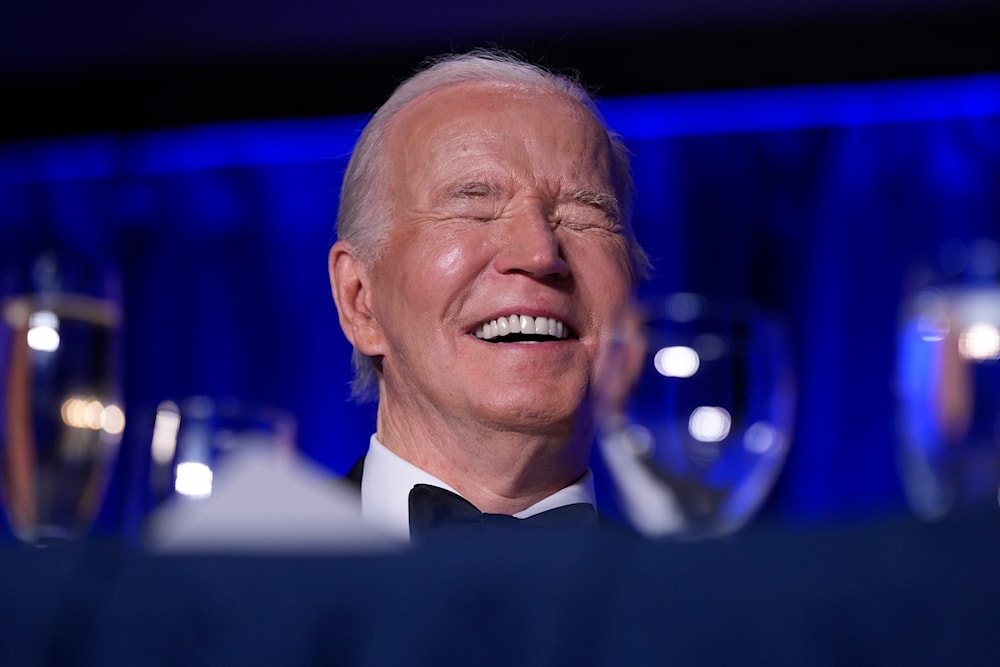 President Joe Biden laughs as host Colin Jost speaks at the White House Correspondents' Association Dinner at the Washington Hilton, Saturday, April 27, 2024, in Washington. (AP)