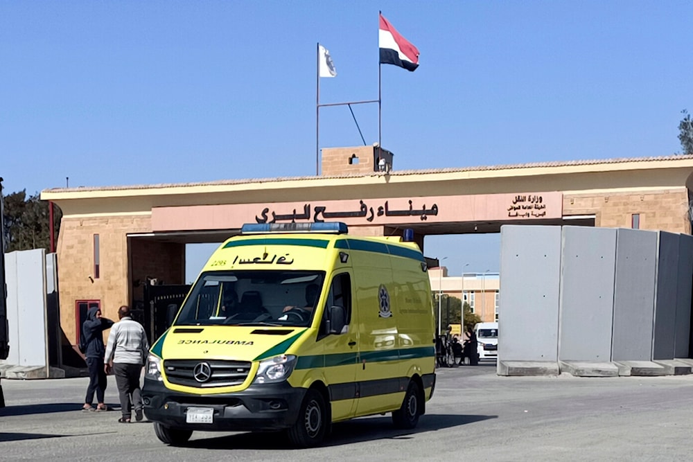 An ambulance carrying bodies of the foreign humanitarian aid workers killed in a recent Israeli airstrike in Gaza crosses the Rafah border crossing between Egypt and the Gaza Strip, Wednesday, April 3, 2024 (AP Photo/Ahmed Abudraa)