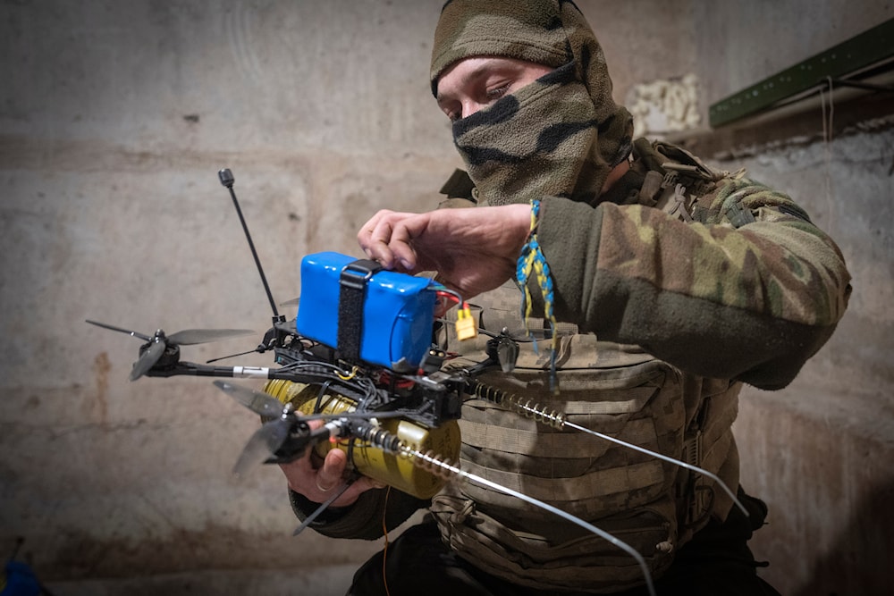 A Ukrainian soldier of the 71st Jaeger Brigade prepares a FPV drone at the frontline, near Avdiivka, Donetsk region, Ukraine, Friday, March 22, 2024. (AP)